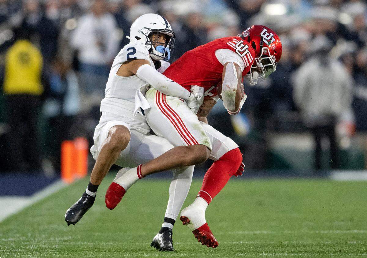 Penn State safety Keaton Ellis stops Utah’s Ja’Quinden Jackson during the Rose Bowl game on Monday, Jan. 2, 2023.