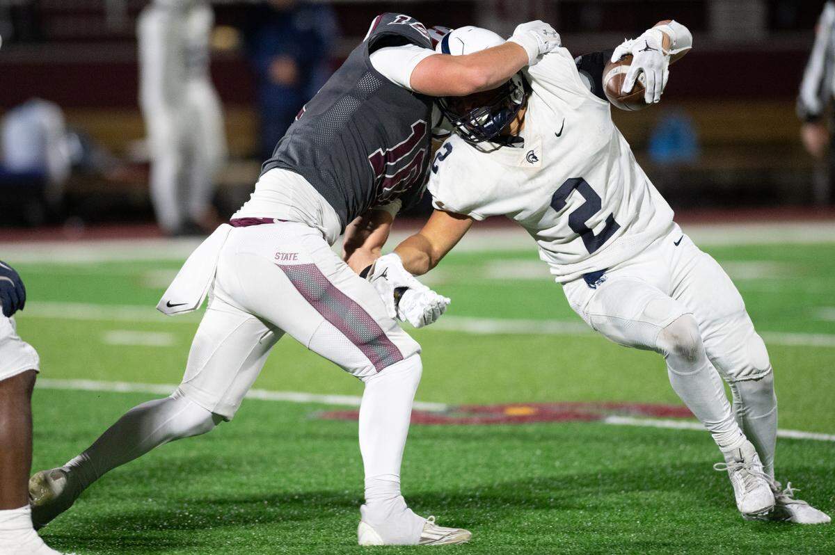 McDowell wide receiver Gavin Magorien is tackled by State High linebacker Michael Gaul during the football game at Memorial Field on Friday, Nov. 8, 2024.