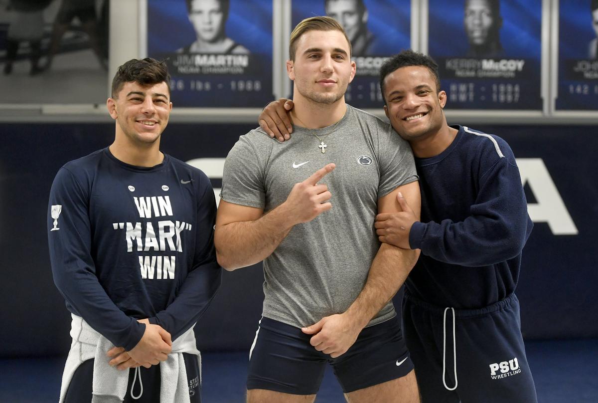 Penn State wrestlers Joseph Vincenzo, Anthony Cassar and Mark Hall laugh as they pose together for a photo during media day on Tuesday, Nov. 5, 2019.