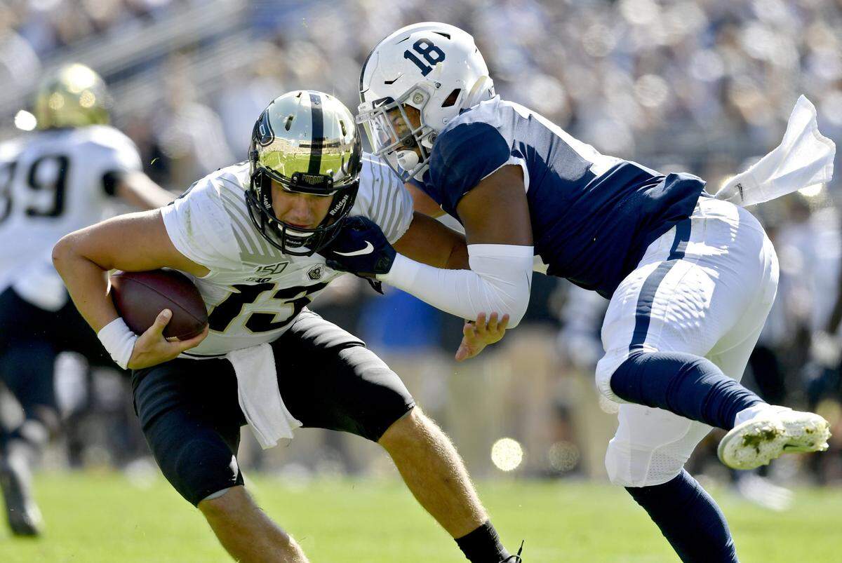 Penn State defensive end Shaka Toney pulls down Purdue quarterback Jack Plummer during the game on Saturday Oct. 5, 2019.