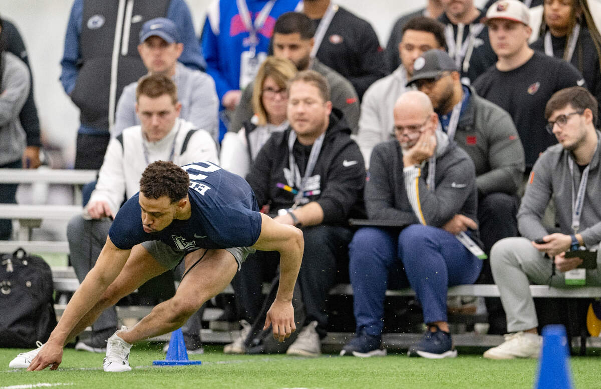 NFL scouts watch as safety Keaton Ellis runs the 3 cone drill during Penn State’s Pro Day on Friday, March 15, 2024 in Holuba Hall.