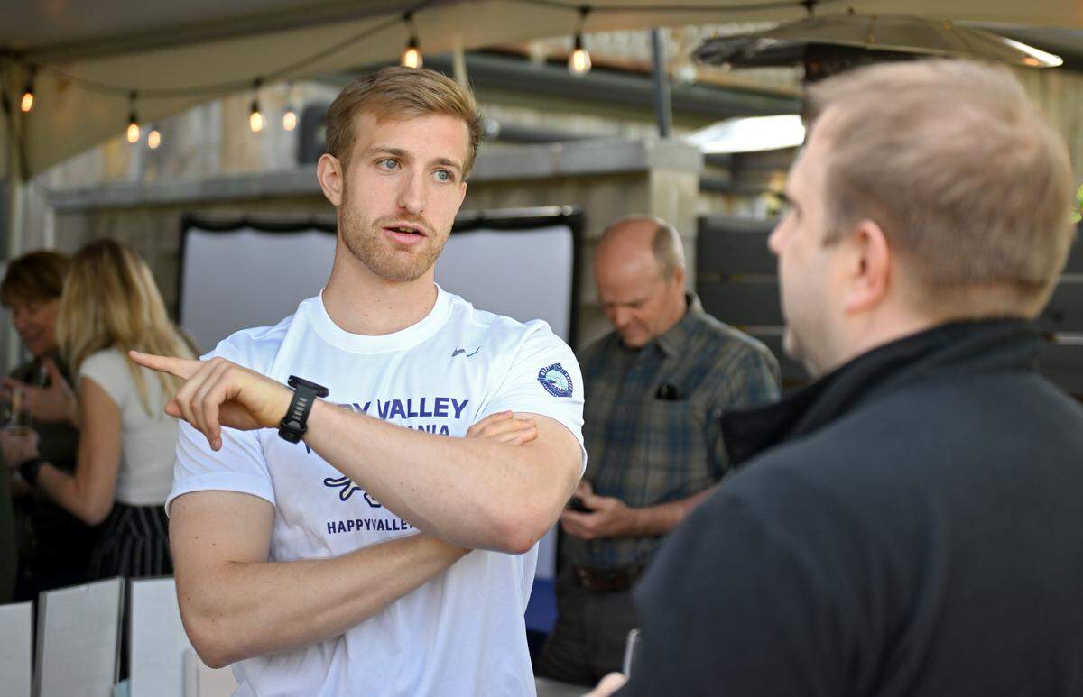 Matthew Hollingham talks about his upcoming Arctic Circle to Africa triathlon on Tuesday, May 12, 2026 during a send-off event hosted by the Happy Valley Adventure Bureau.  