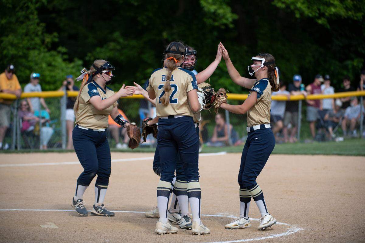 Bald Eagle players high five before the start on an inning during the PIAA Class 3A Softball Championships between Bald Eagle Area High School and Southmoreland High School at Milesburg Youth Baseball Complex on June 6, 2022 in Milesburg.