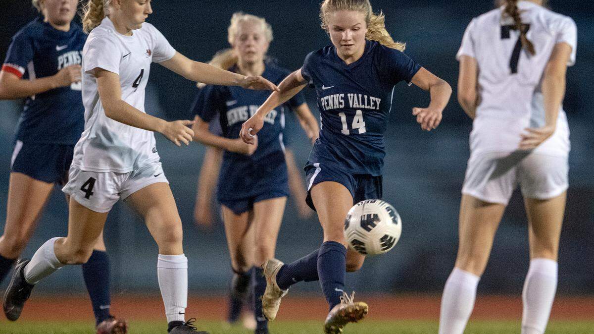 Penns Valley’s Scotty Dinges tries to cut between Clearfield defenders during the soccer game on Wednesday, Oct. 20, 2021.