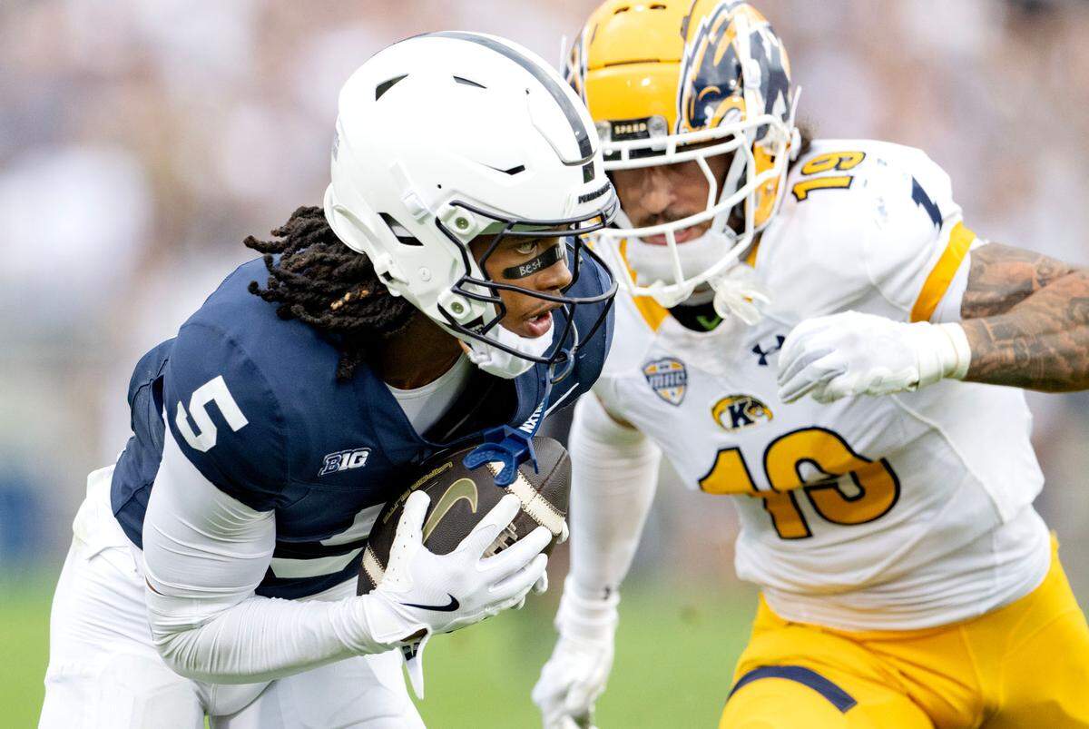 Penn State wide receiver Omari Evans makes a catch and cuts around Kent State defensive back Jaylen Dotson during the second quarter of the game on Saturday, Sept. 21, 2024 at Beaver Stadium.