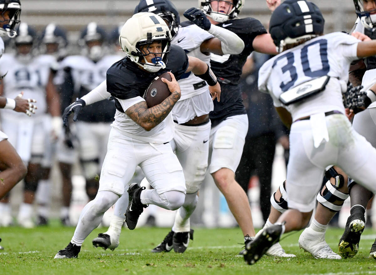 Penn State running back D’Antae Sheffey cuts down the field with the ball during Blue-White Practice on Saturday, April 25, 2026.