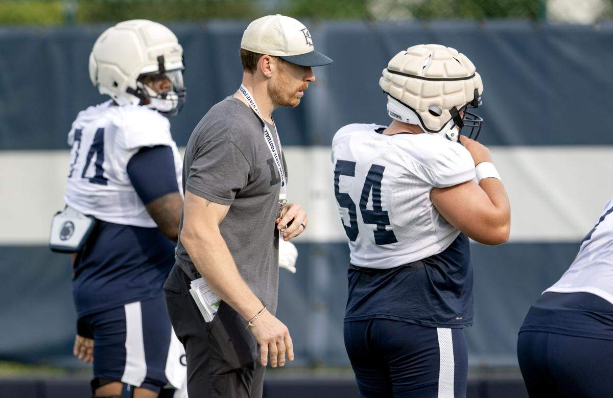 Penn State offensive line coach Phil Trautwein has his players run drills during practice on Saturday, Aug. 2, 2025.  