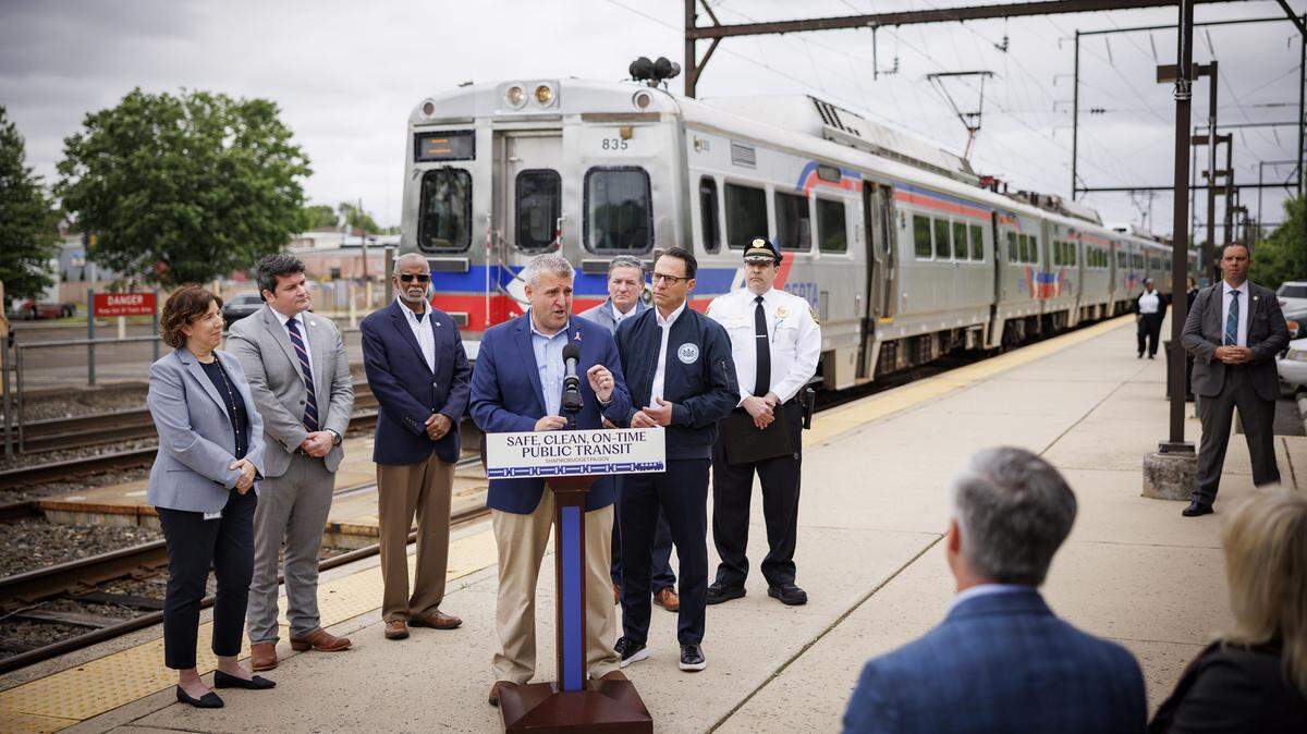State Sen. Frank Farry (center) spoke at a May news conference to support more funding for SEPTA.