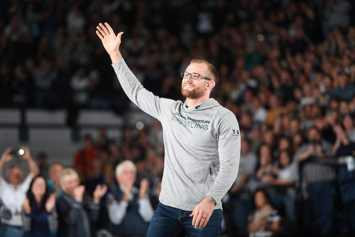 Former Penn State wrestler and world champion David Taylor waves to the crowd at Sunday’s wrestling meet between Penn State and Kent State. Penn State defeated Kent State, 52-3.