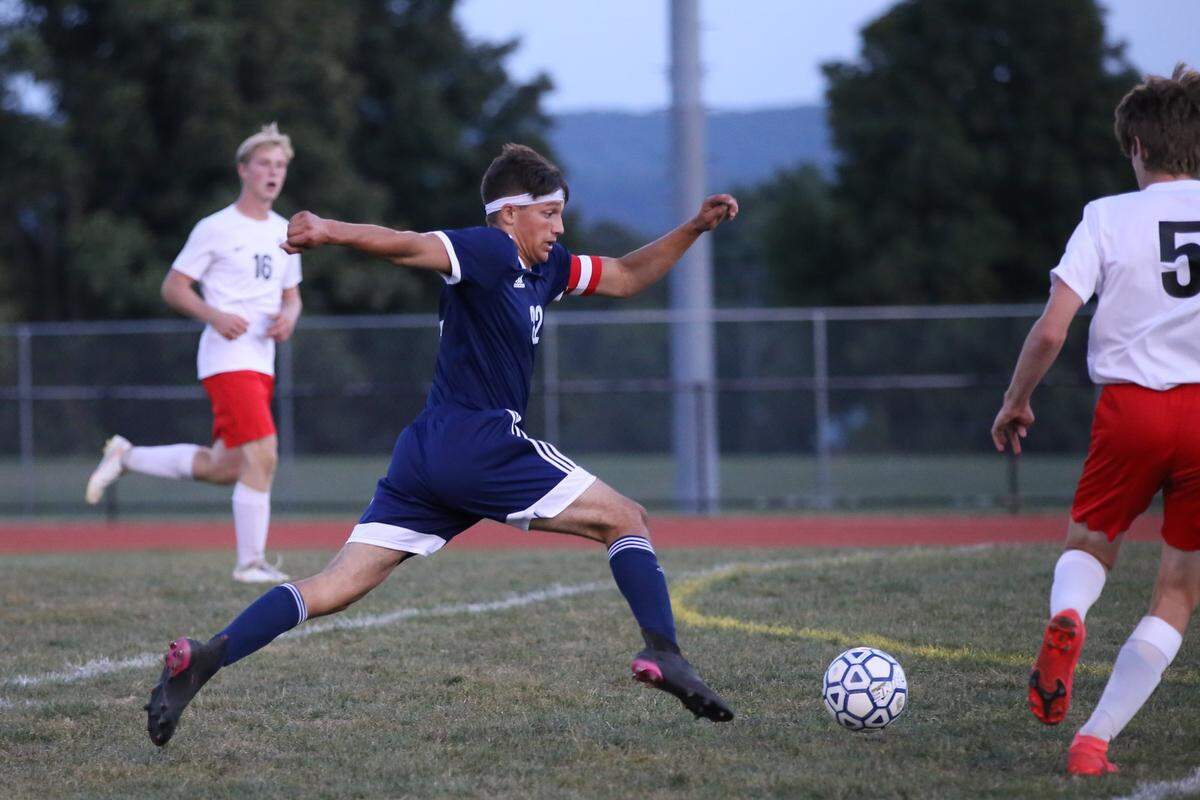 Penns Valley senior Midfielder Michael Johnson pushes the attack against a Central defender in a home match at Penns Valley on Wednesday.