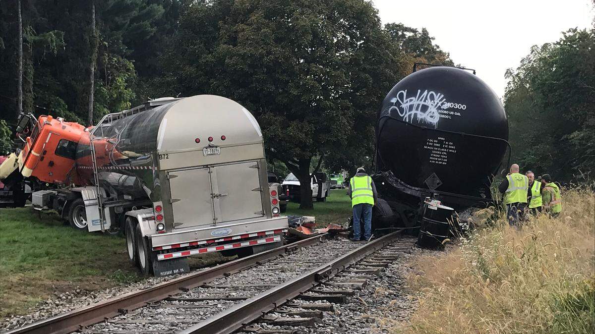 A railroad tanker car was pushed off the tracks after a Tuesday morning crash on East College Avenue.