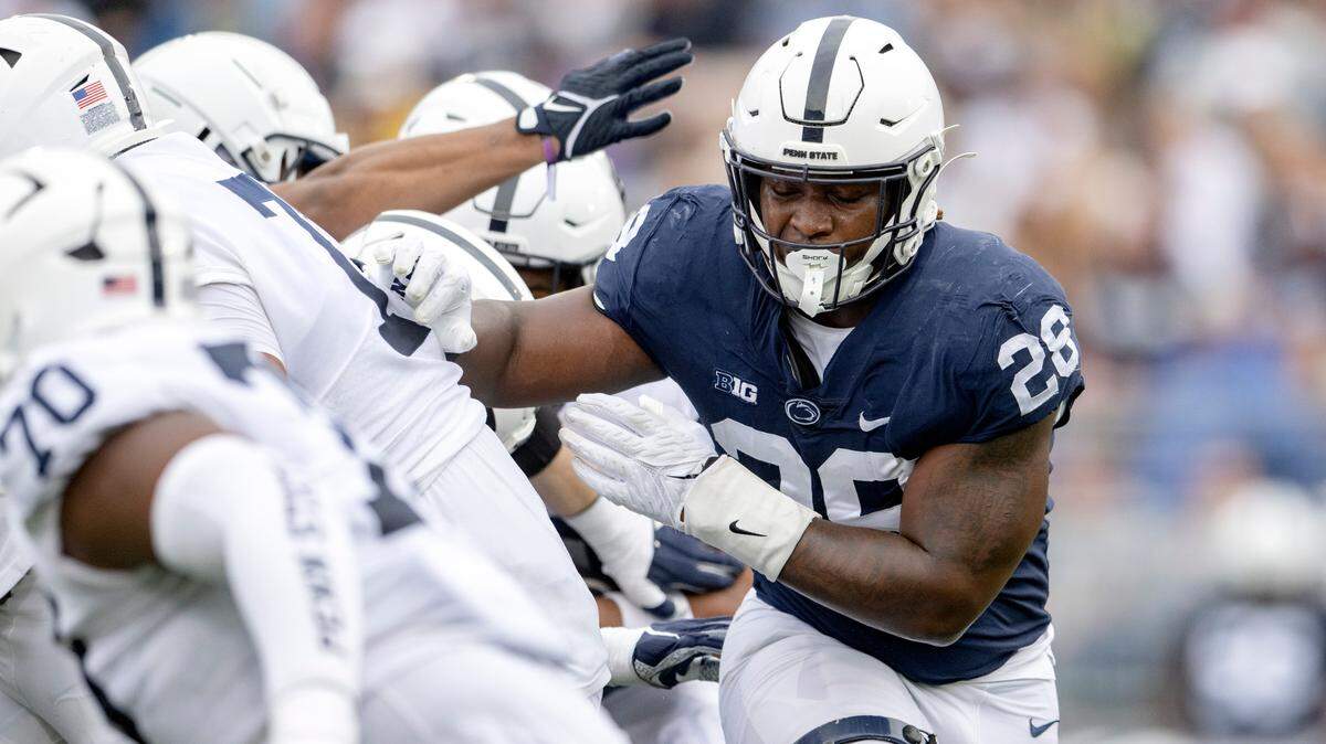 Defensive end Adisa Isaac cuts through the line during the Penn State Blue-White game on Saturday, April 15, 2023.