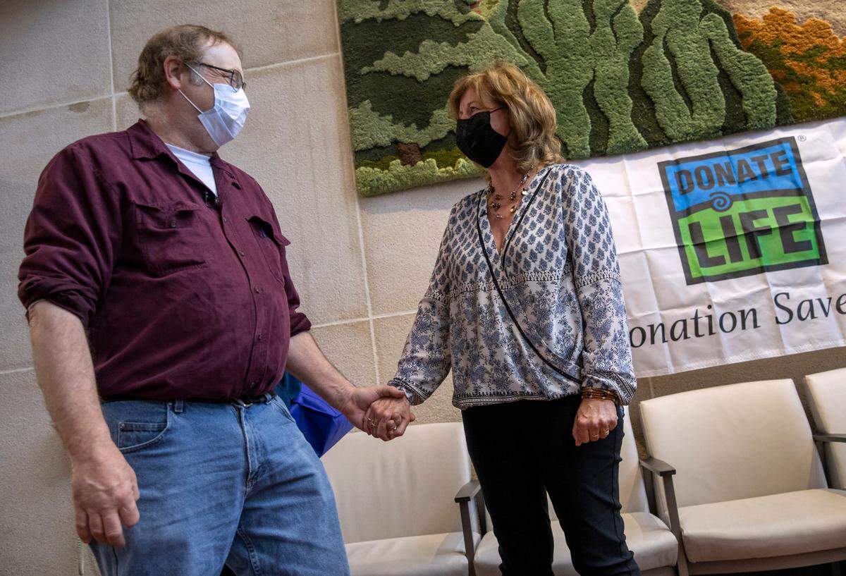 Dwayne Weller, left, and Maureen Stathes meet for the first time in the lobby of Penn State Health Milton S. Hershey Medical Center on Wednesday, April 6, 2022. Stathes donated a kidney to Weller and they met to help celebrate National Donate Life Month.