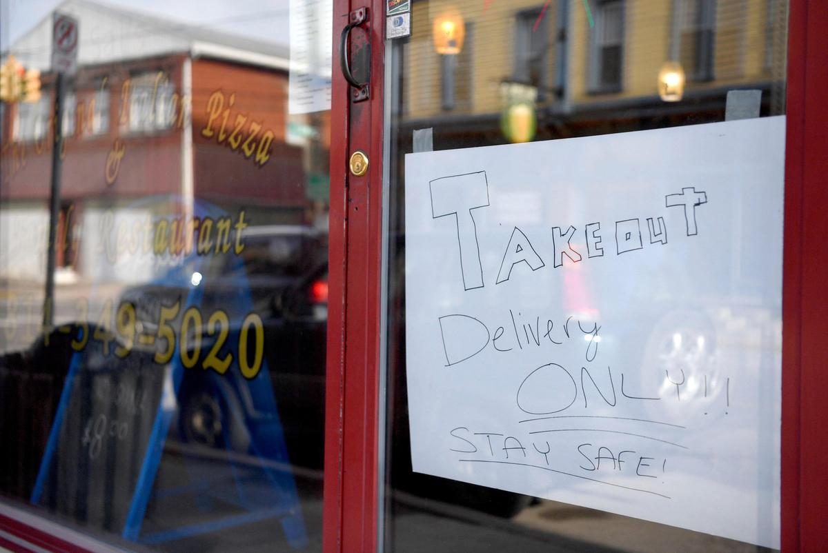 A friendly reminder to stay safe on a the takeout and delivery only sign at the Original Italian Pizza in Millheim on Thursday, March 26, 2020.