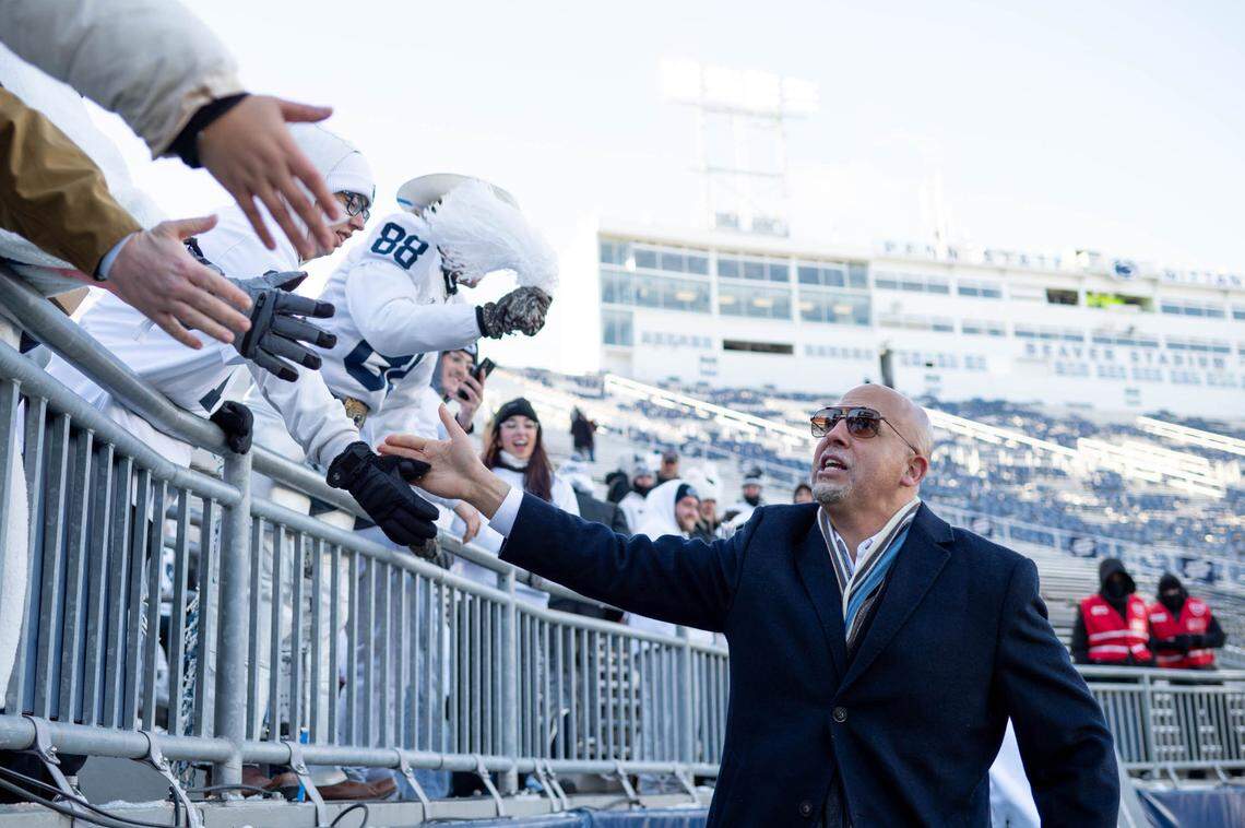 Penn State head coach James Franklin high-fives fans as he enters Beaver Stadium for the college football playoff game on Saturday, Dec. 21, 2024.