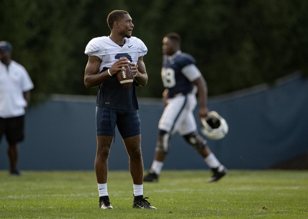 Penn State wide receiver DeAndre Thompkins tosses the ball around with teammates after practice on Wednesday, Aug. 29, 2018.