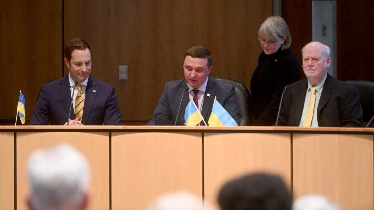 Mayor Oleksandr Kodola from Nizhyn, Ukraine, reads the sister city memorandum of understanding at the State College Borough Building on Wednesday, May 3, 2023.