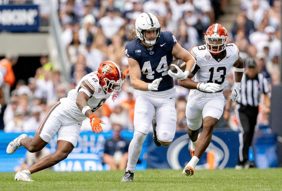 Penn State tight end Tyler Warren cuts down the field with the ball ahead of Bowling Green defenders during the game on Saturday, Sept. 7, 2024.