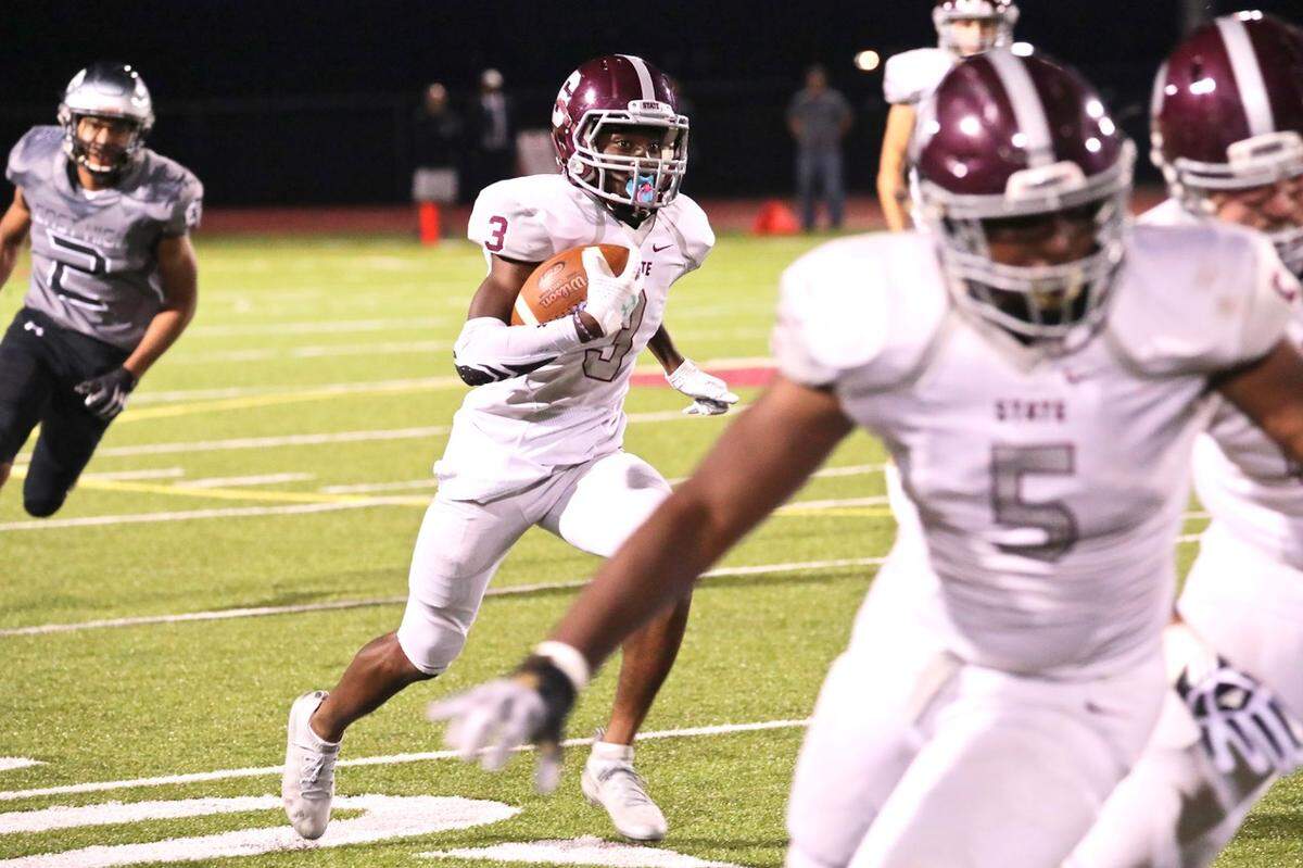 State College’s Lokey Howell runs down the field against Central Dauphin East on Friday. State College won 48-7.
