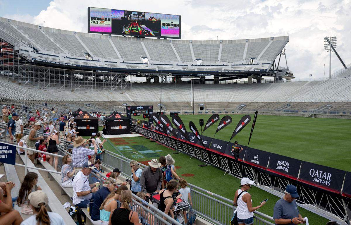 People gather in Beaver Stadium to cheer athletes to the finish line for the Ironman 70.3 Pennsylvania Happy Valley on Sunday, June 30, 2024.