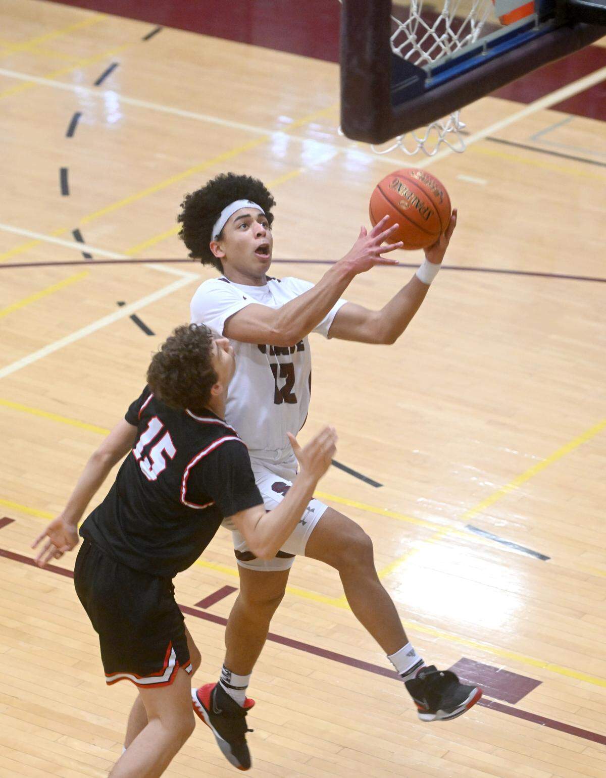 State College’s Lake Black goes in for a basketball during the PIAA first round game against Upper St. Clair on Saturday, March 11, 2023. State College won, 72-42.