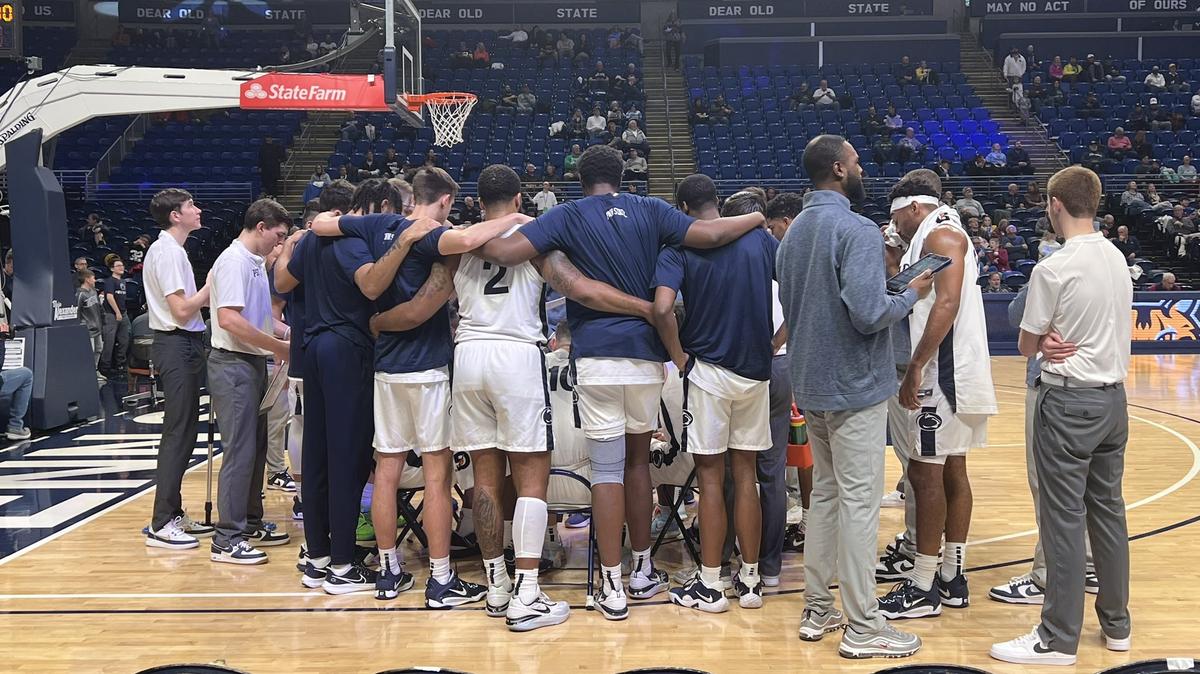 Penn State men’s basketball huddles in a timeout during the game against Quinnipiac on Thursday, Dec. 22, 2022.