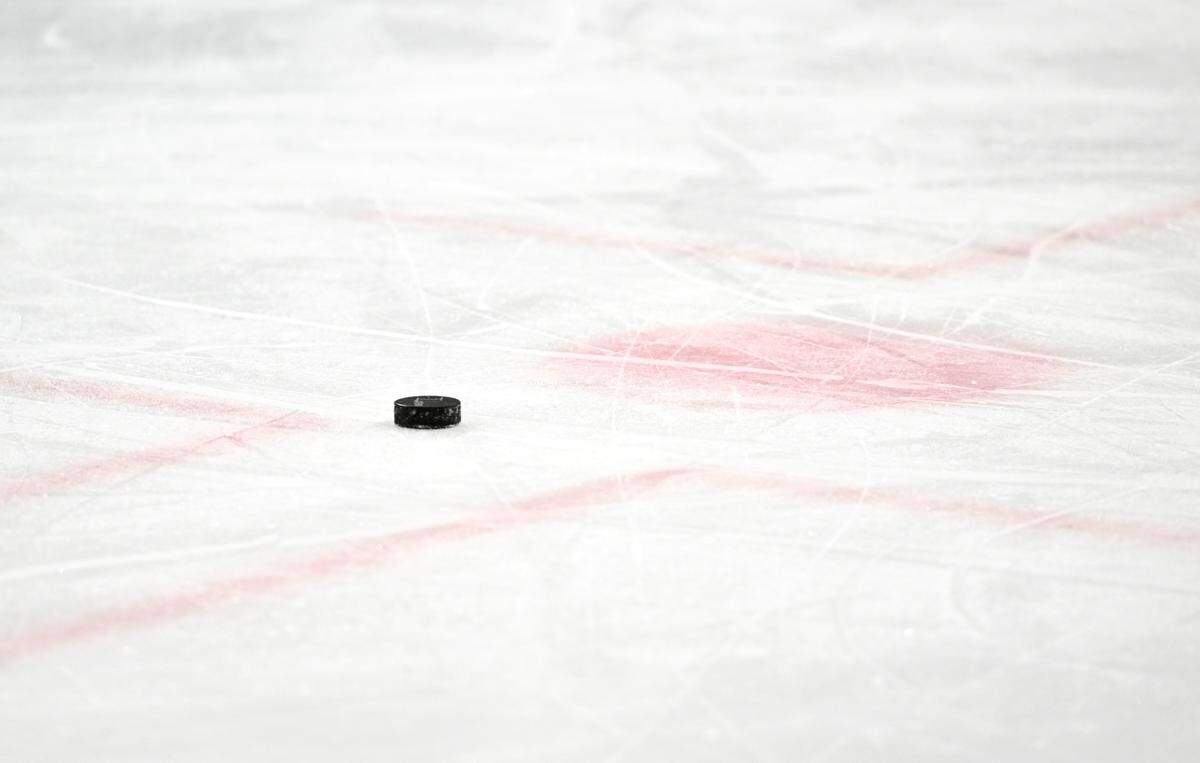 A puck on the ice during State College middle school secondary hockey team practice on Friday, March 17, 2023.