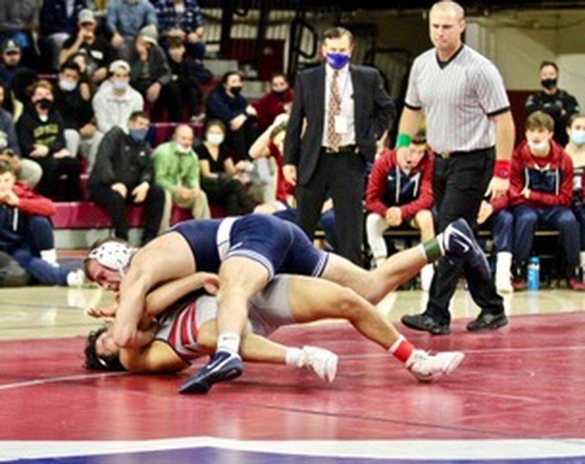 Penn State’s Donovon Ball looks for a pin against Penn’s Jesse Martinez in their 184-pound bout on Friday in the Palestra. The Nittany Lions rallied for a 20-16 win as Ball earned an 11-4 victory in place of missing Aaron Brooks.