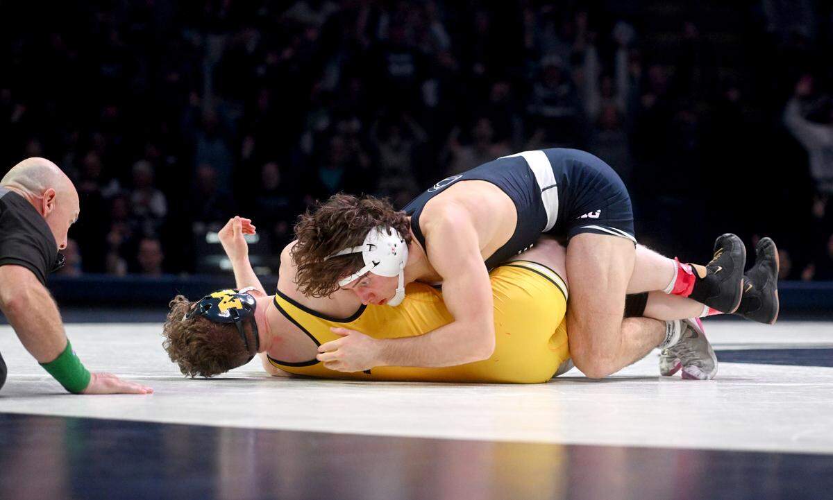 Penn State’s Levi Haines takes down Michigan’s Will Lewan in sudden victory to win the 157 lb bout of the match on Friday, Jan. 20, 2023 at the Bryce Jordan Center.