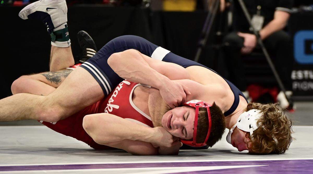 Penn State’s Levi Haines scores nearfall points on Nebraska’s Lenny Pinto in their 174-pound finals match of the Big Ten championships on March 9 inside Welsh Ryan Arena in Evanston, Ill. Haines topped Pinto, 12-1, for his third conference title.