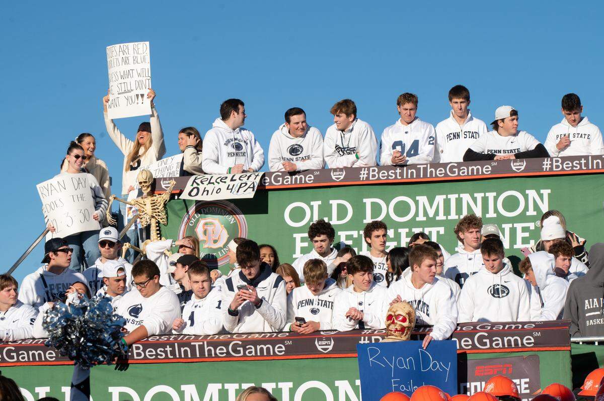 Penn State fans hold up signs on the set of ESPN College GameDay before the game against Ohio State at Beaver Stadium on Saturday, Nov. 2, 2024.