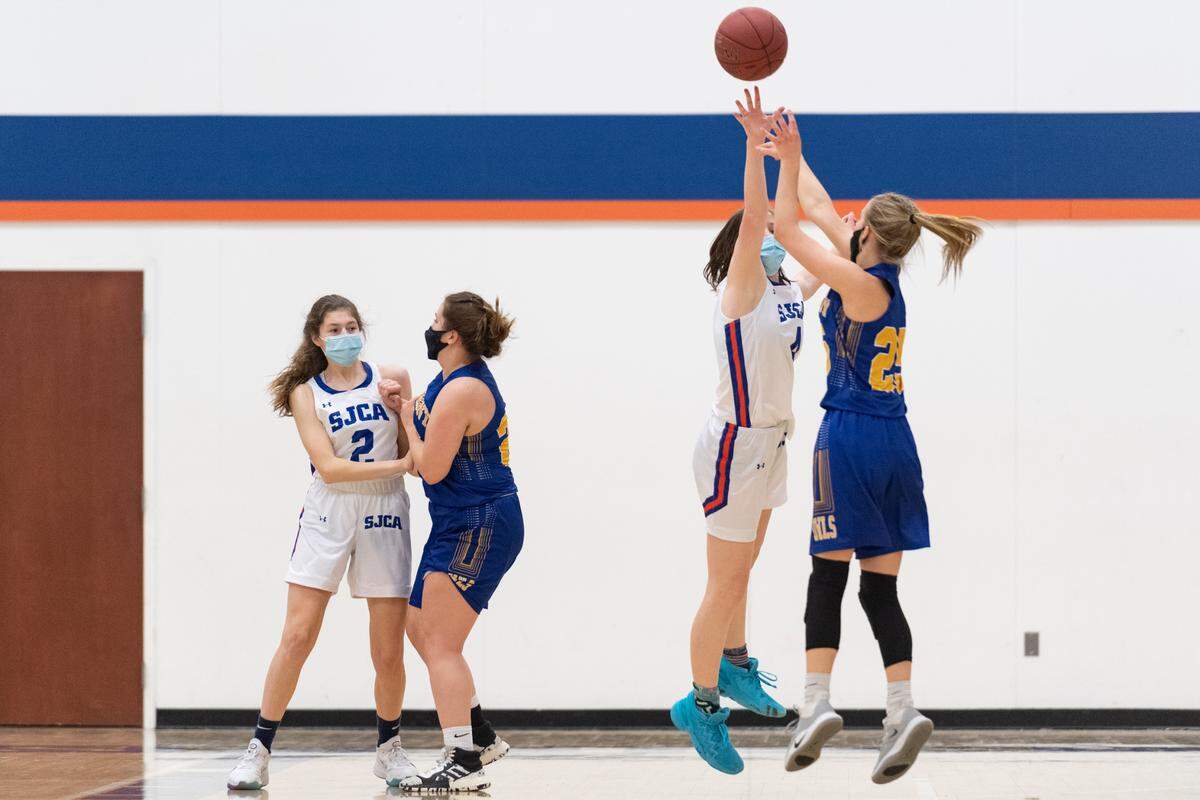 Saint Joseph’s Kate Youngmark defends a shot during their game against Harmony Christian School at Saint Joseph’s Catholic Academy on March 1, 2021 in Boalsburg.