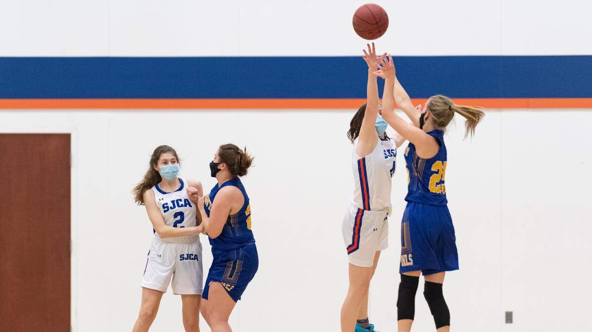 Saint Joseph’s Kate Youngmark defends a shot during their game against Harmony Christian School at Saint Joseph’s Catholic Academy on March 1, 2021 in Boalsburg.