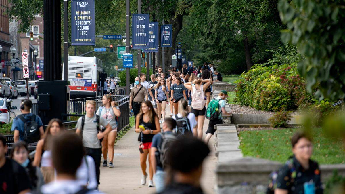 Penn State students walk on campus on the first day of classes on Monday, Aug. 23, 2021.