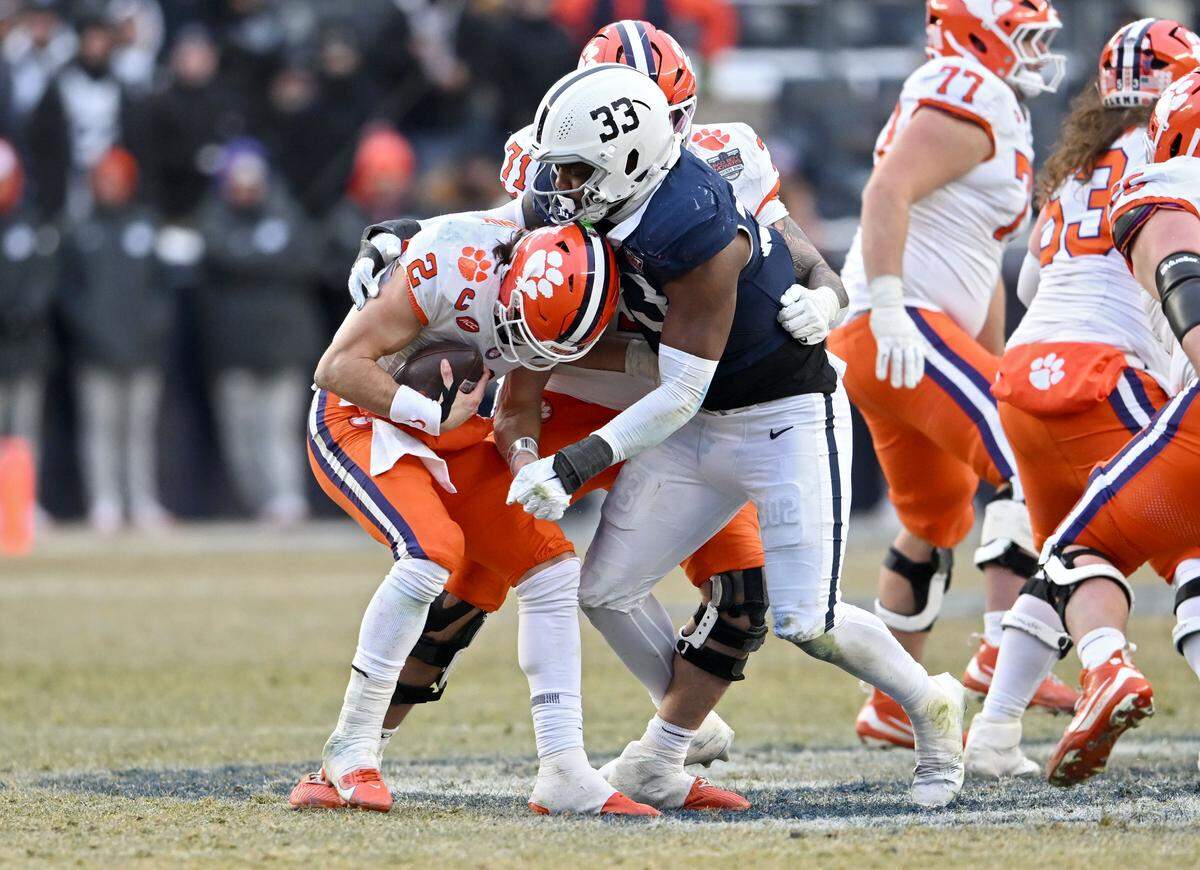 Penn state defensive end Dani Dennis-Sutton stops Clemson quarterback Cade Klubnik during the Pinstripe Bowl at Yankee Stadium on Saturday, Dec. 27, 2025.