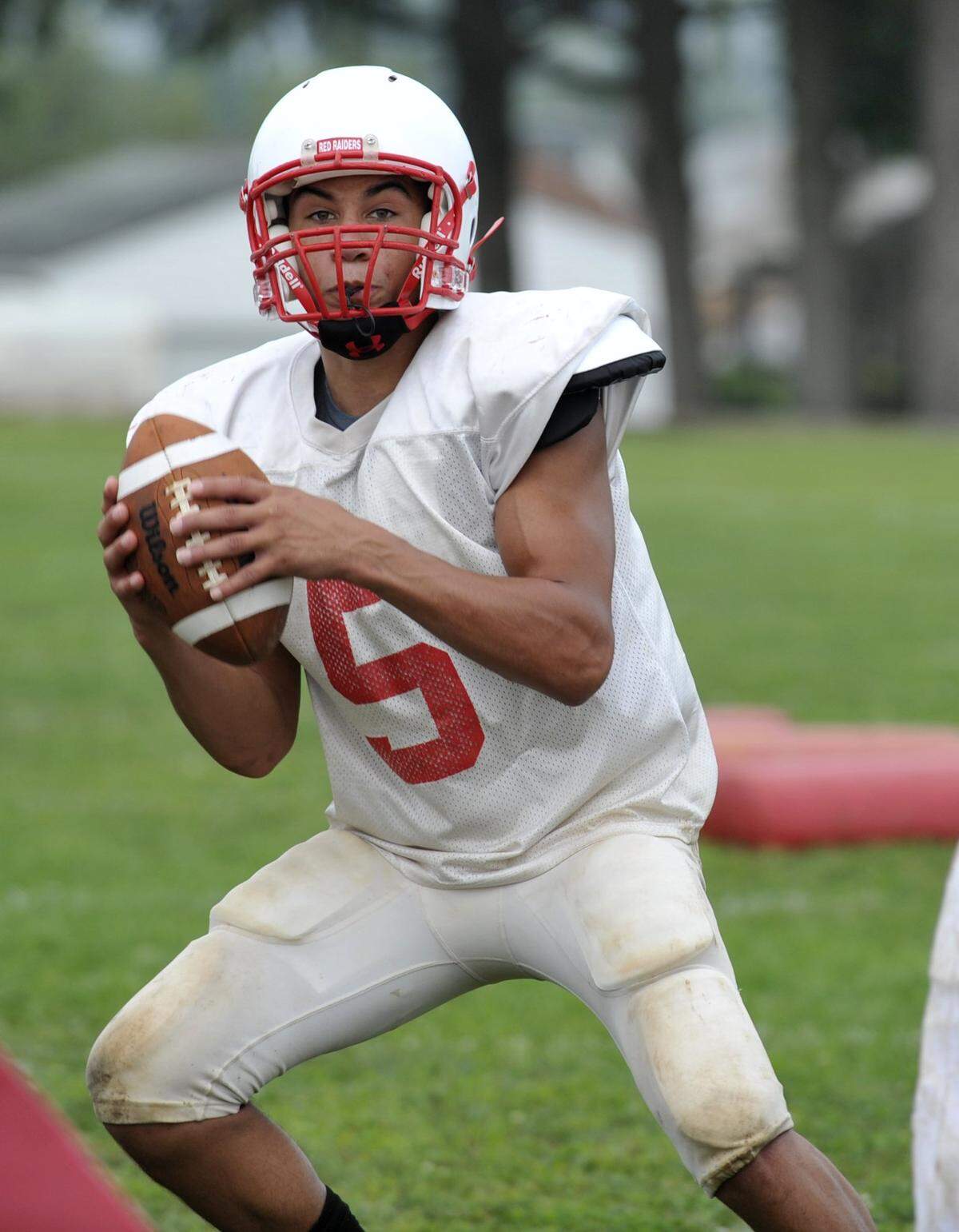 Tyler Lucas runs the ball during Bellefonte Area High School football practice August 16, 2010. CDT/Nabil K. Mark