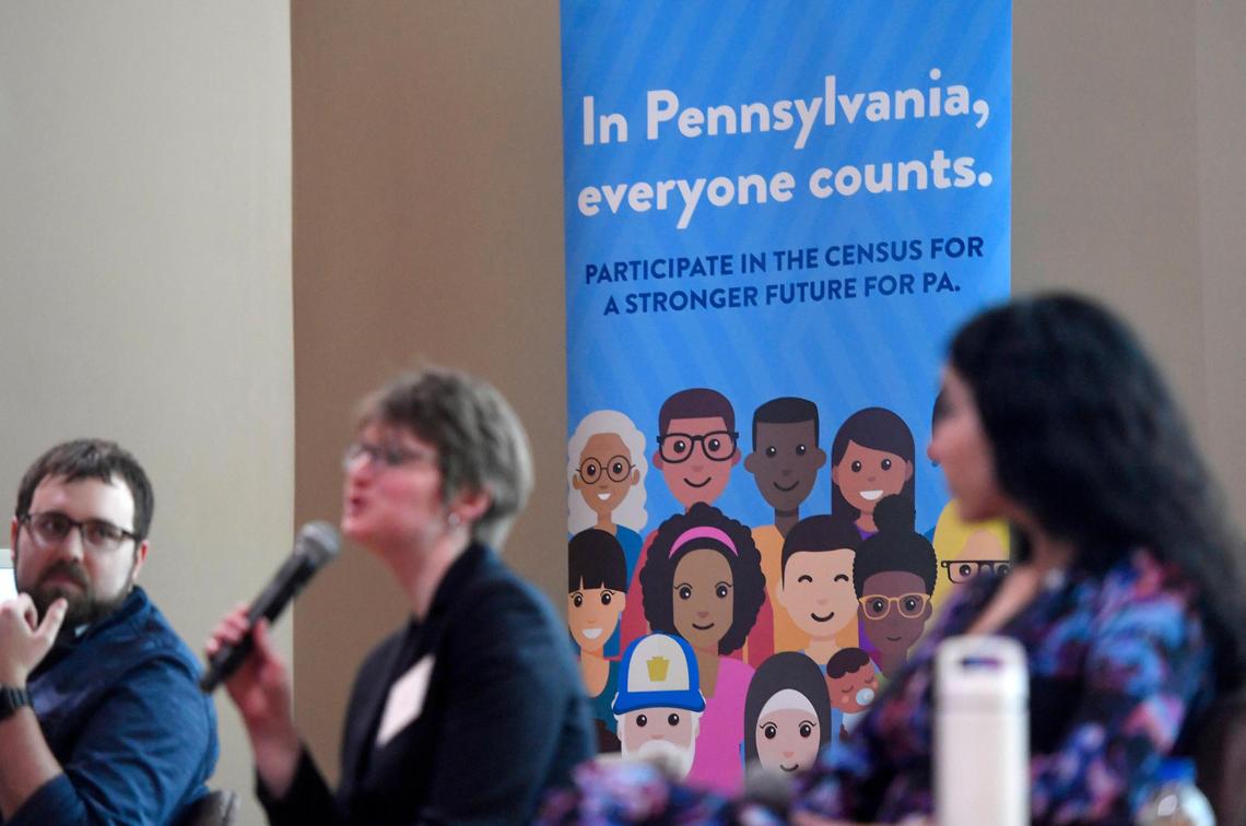 Signs promoting participation in the 2020 Census hang during a panel discussion on Wednesday in the HUB at Penn State.