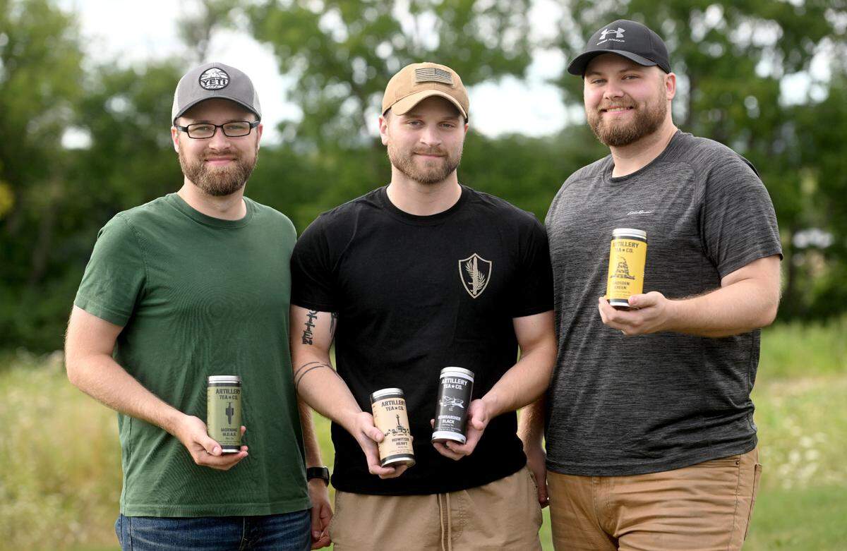 Brothers Mike, Joe and Chris Britton of Artillery Tea Co. pose with their products on Thursday, Aug. 11, 2022.
