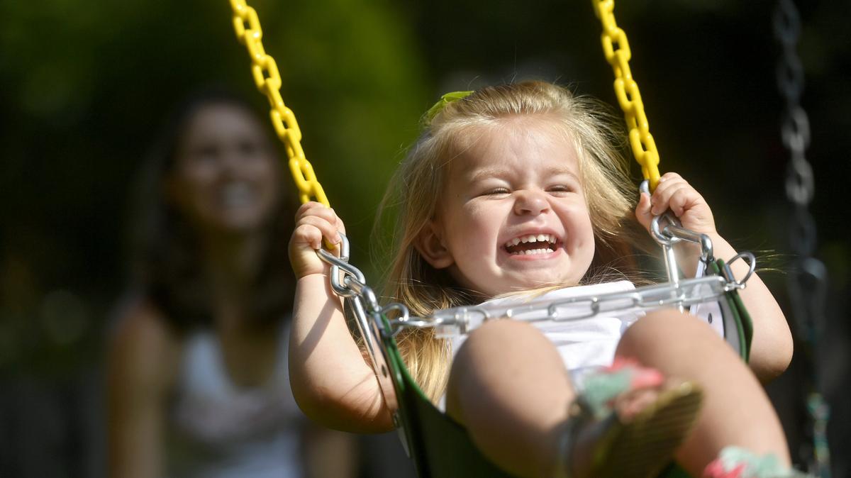 Lia Florio giggles as her mom Kristi pushes her on the swing on their new play set in July 2017. In August, a Hot Rod Poker Run will be held to benefit Lia, who has a rare genetic disorder.