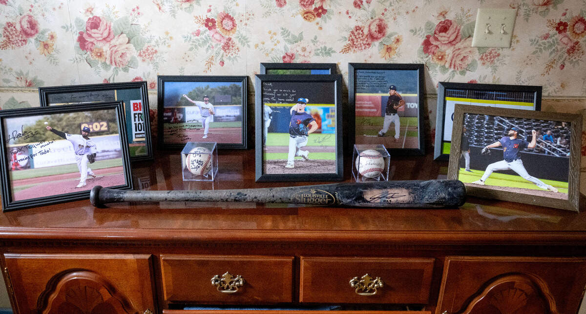 Photos of State College Spikes players that stayed with host Frank Kachurak last season are pictured in his home.