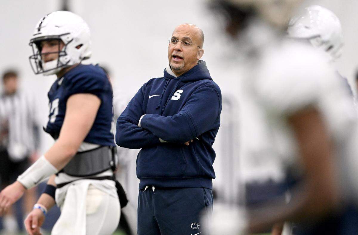 Penn State football coach James Franklin talks to the quarterbacks during spring practice on Tuesday, April 8, 2025.