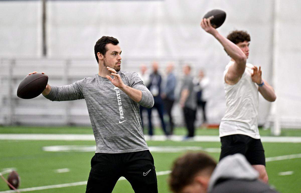 Penn State assistant quarterback coach Trace McSorley and current quarterback Drew Allar warm up to make passes during Penn State football’s pro day on Friday, March 28, 2025.