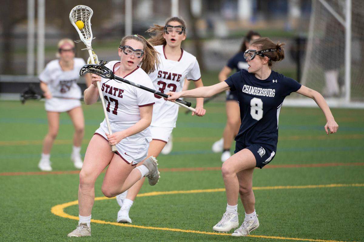 State College’s Leah Moyer (17) runs to goal during a lacrosse game between State High and Chambersburg on Thursday.