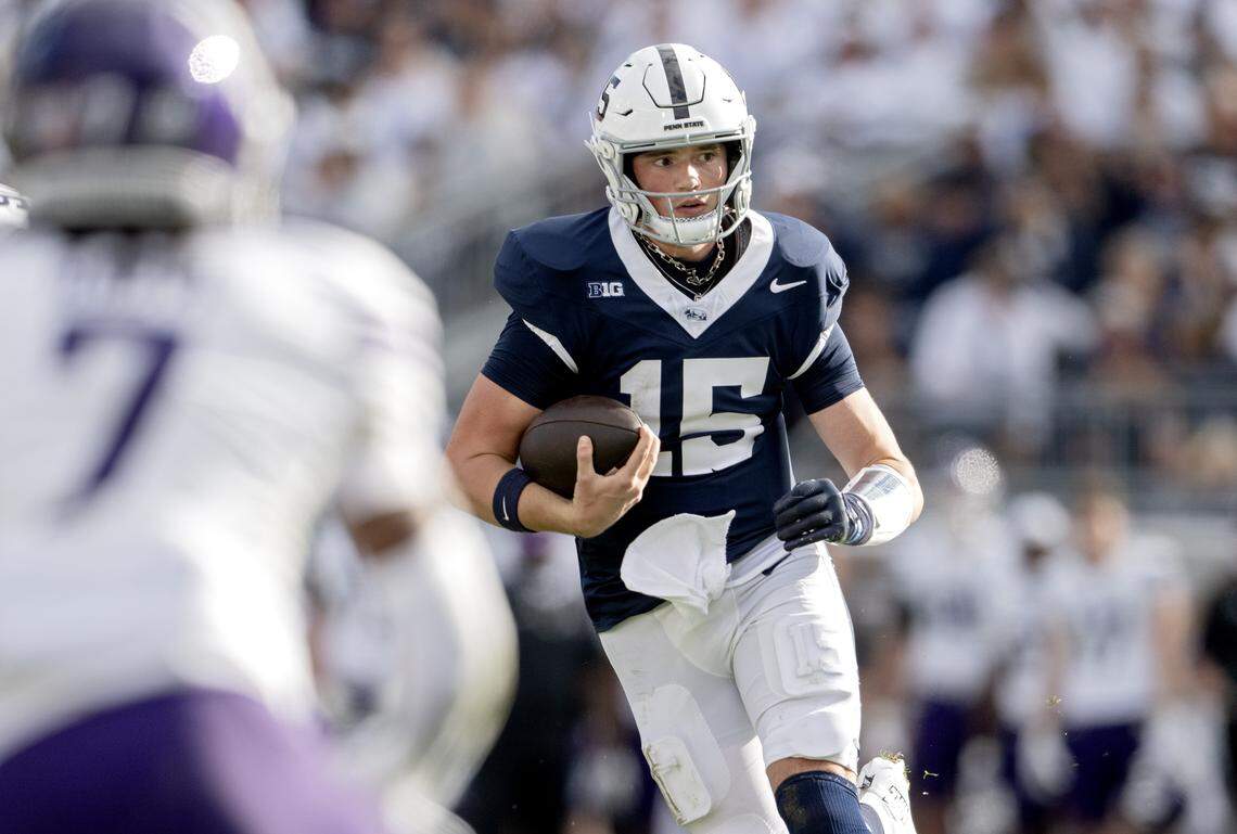Penn State quarterback Drew Allar runs with the ball from Northwestern defenders during the game on Saturday, Oct. 11, 2025.