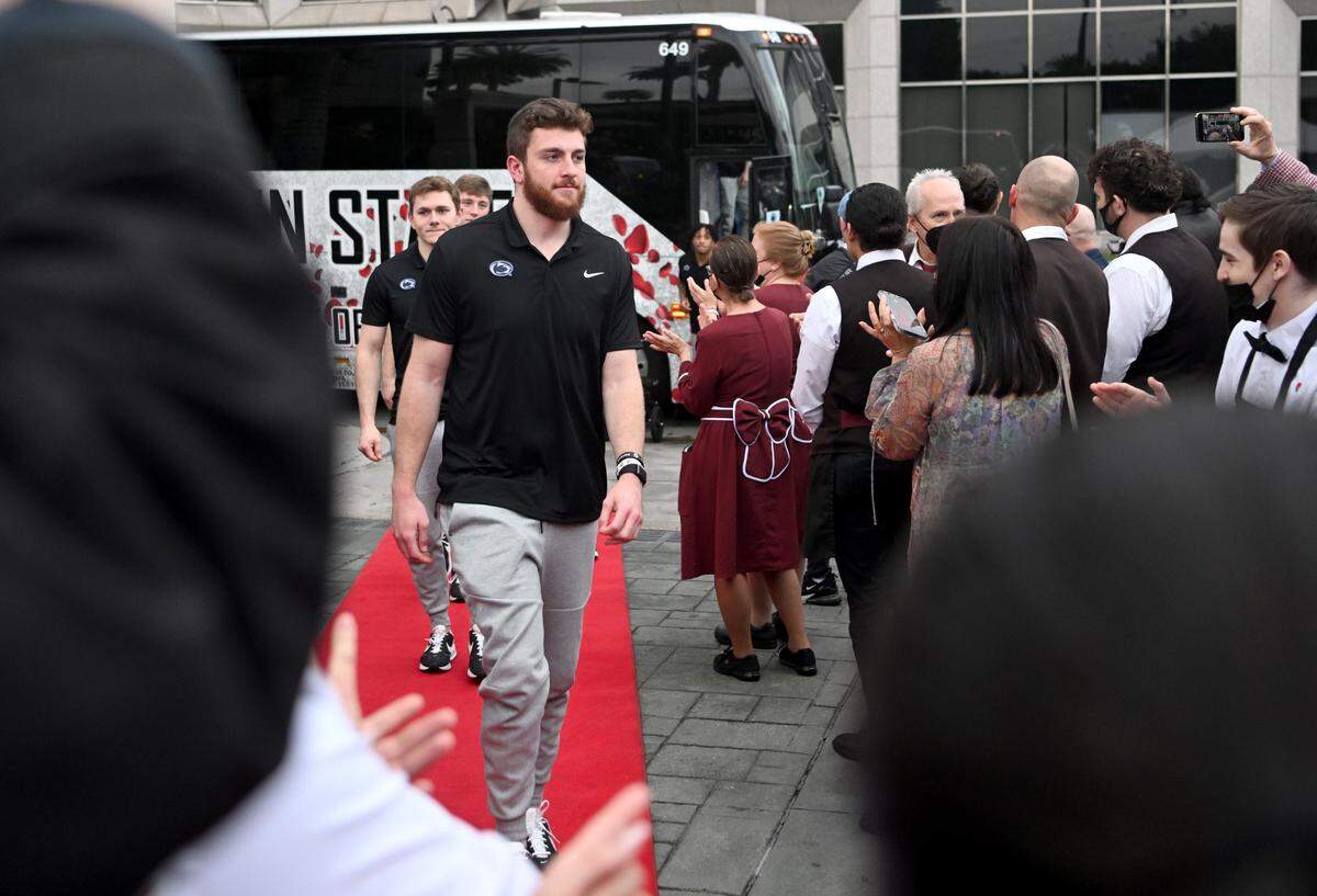 Penn State quarterback Sean Clifford and his teammates are welcomed by the staff to the Lawry’s Beef Bowl on Friday, Dec. 30, 2022.
