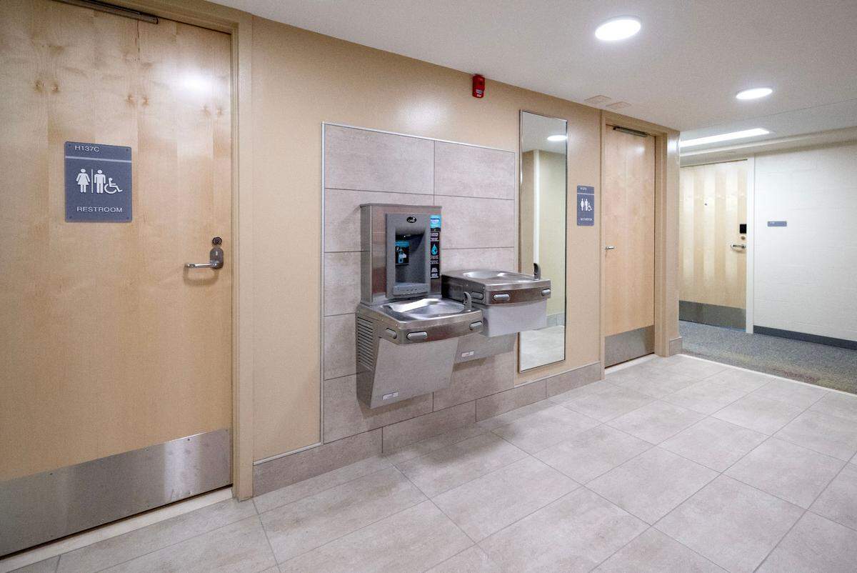 Single use bathrooms and a water bottle fill station on the second floor of Hastings Hal.