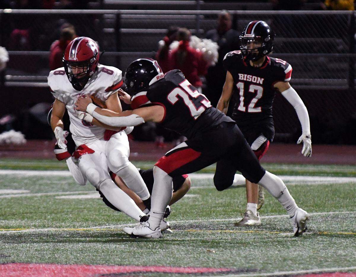 Bellefonte’s Dominic Capperella shakes off a tackle from Clearfield’s Mark McGonigal on Friday night.