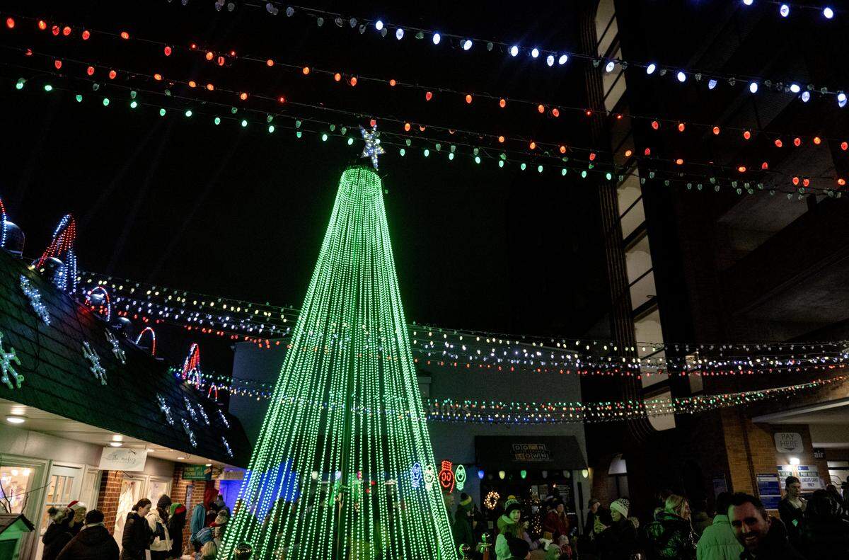 People gather in the MLK Plaza during Light Up Night on Thursday, Nov. 20, 2025. The holiday light show will run 5-10 p.m. nightly. 