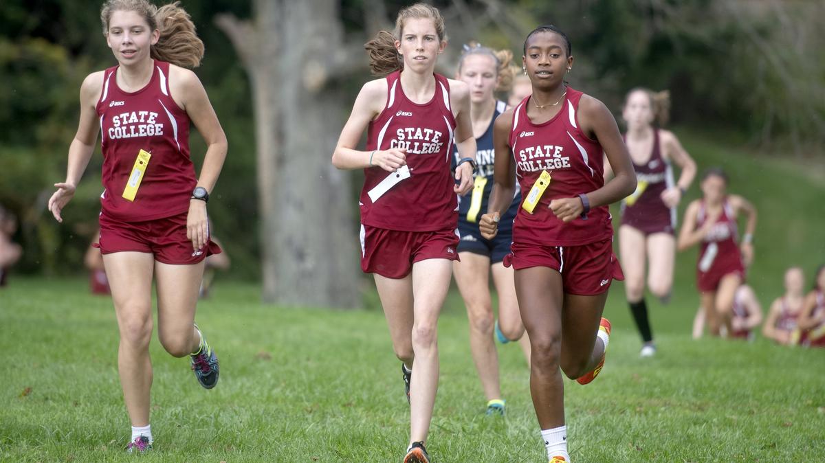 State College’s Emma Simon, Jordan Reed and Mihret Strauss lead the pack up the hill during the cross country meet on Monday, Oct. 8, 2018 at Circleville Park. Reed finished in first with a time of 20:57, Simon in second and Strauss in third.