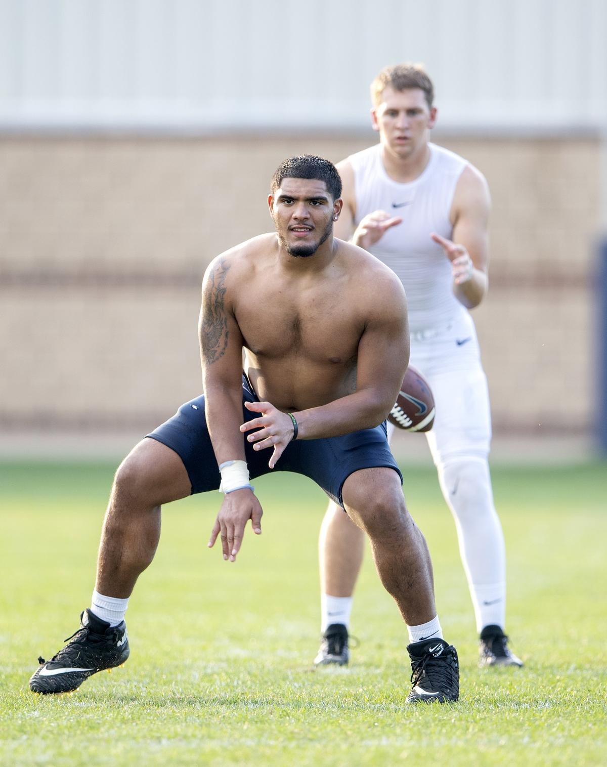 Penn State offensive lineman Juice Scruggs snaps the ball to quarterback Will Levis during practice on Wednesday, Aug. 29, 2018.